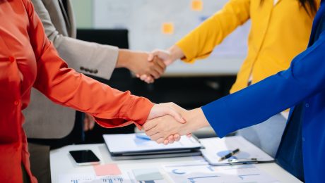 Business partnership handshake concept.Photo two coworkers handshaking process.
